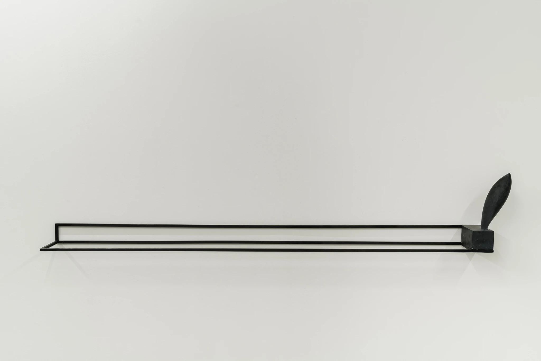 Still a plinth, 2019 Black limestone, iron 8x164x16 cm